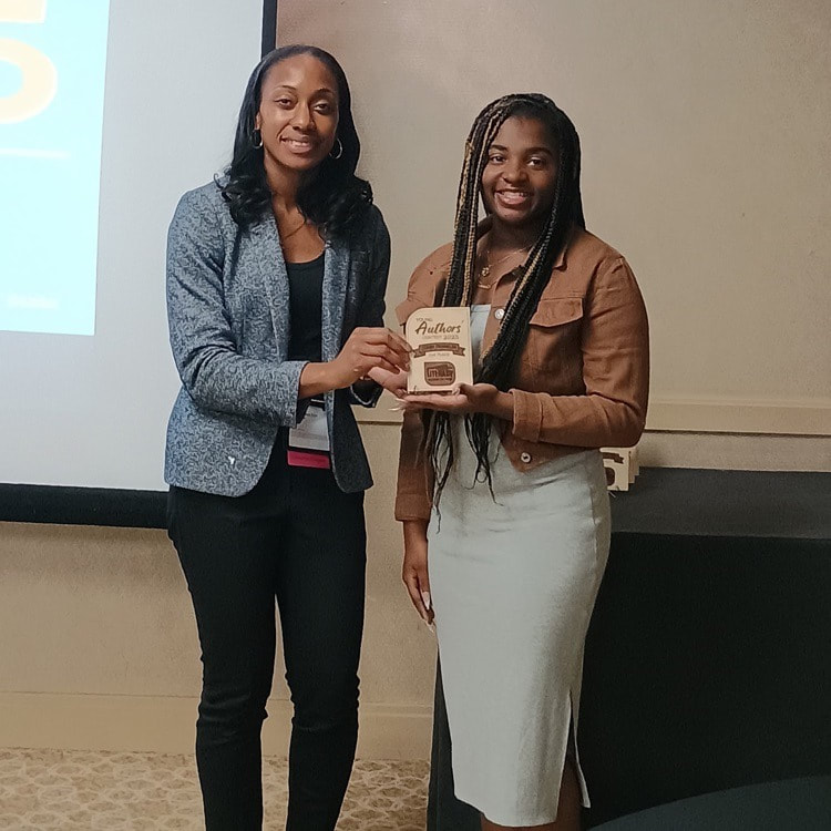 Earning 2nd place in grade 12 poetry is Ziann Franklin, right, of Pocomoke High School.